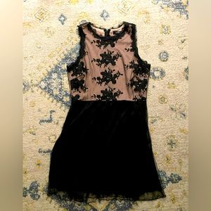 Nude with black overlay dress